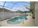 Kidney shaped pool with screened enclosure at 315 19Th Nw St, Ruskin, FL 33570