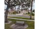House on tree-lined street with bench, aerial view at 315 19Th Nw St, Ruskin, FL 33570