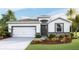 One-story home with a two-car garage and landscaped front yard at 3548 Thistle Bank Ct, Plant City, FL 33565