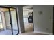 View of living room and kitchen with sliding glass doors to patio at 4745 Puritan Cir # 4745, Tampa, FL 33617