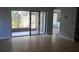 Living room with tile floors and sliding glass doors leading to a patio at 4745 Puritan Cir # 4745, Tampa, FL 33617