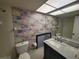 Bathroom with floral wallpaper and marble vanity at 4895 Bay Ne St # 211, St Petersburg, FL 33703