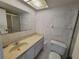 Clean bathroom with single sink vanity, toilet and shower at 4895 Bay Ne St # 211, St Petersburg, FL 33703