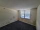 Empty bedroom with gray carpeting and window coverings at 4895 Bay Ne St # 211, St Petersburg, FL 33703
