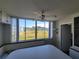 Bright bedroom with large window offering a view of a lush green space at 4895 Bay Ne St # 211, St Petersburg, FL 33703