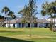 Exterior view of a well-maintained community building with a grassy yard at 4895 Bay Ne St # 211, St Petersburg, FL 33703