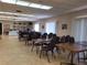 Community room with tables, chairs, and bookcase at 4895 Bay Ne St # 211, St Petersburg, FL 33703