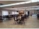Spacious community room with ample seating, kitchen facilities, and bookcases at 4895 Bay Ne St # 211, St Petersburg, FL 33703