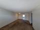 Spacious living room with carpeting and access to other rooms at 4895 Bay Ne St # 211, St Petersburg, FL 33703