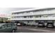 Parking lot view of condo building with covered parking and ample spaces at 4895 Bay Ne St # 211, St Petersburg, FL 33703