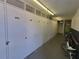 Well-lit hallway with numbered storage units and bicycle parking at 4895 Bay Ne St # 211, St Petersburg, FL 33703