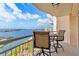 Balcony with table and chairs overlooking water and city views at 4900 Brittany S Dr # 1512, St Petersburg, FL 33715