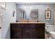 Double vanity bathroom with two sinks and framed mirrors at 4900 Brittany S Dr # 1512, St Petersburg, FL 33715