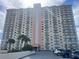 Condo building exterior, featuring parking and landscaping at 4900 Brittany S Dr # 1512, St Petersburg, FL 33715