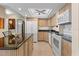 Bright kitchen featuring granite countertops and white cabinets at 4900 Brittany S Dr # 1512, St Petersburg, FL 33715