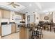 Open concept kitchen with breakfast bar and dining area at 4900 Brittany S Dr # 1512, St Petersburg, FL 33715