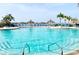 Inviting community pool with ample lounge chairs and waterfront views at 4900 Brittany S Dr # 1512, St Petersburg, FL 33715