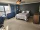 Comfortable bedroom with natural light, ceiling fan, and desk/work area at 5153 Bay Isle Cir, Clearwater, FL 33760