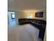 Inviting living room with a large sectional sofa and open floor plan at 5153 Bay Isle Cir, Clearwater, FL 33760