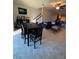 Open-concept living and dining area with tile flooring and comfortable seating at 5153 Bay Isle Cir, Clearwater, FL 33760