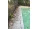 Residential pool with cracked concrete decking needing repair at 5824 58Th Street Ct, Tampa, FL 33619