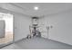 Unfinished basement area with water heater and paint cans at 6220 Westport Dr, Port Richey, FL 34668