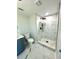 Updated bathroom with a walk-in shower and marble tile at 6220 Westport Dr, Port Richey, FL 34668