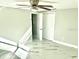 Spacious bedroom with ceiling fan and double doors at 6220 Westport Dr, Port Richey, FL 34668