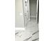 Bright entryway with white door and marble flooring at 6220 Westport Dr, Port Richey, FL 34668