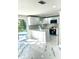 Modern kitchen with white cabinets and island at 6220 Westport Dr, Port Richey, FL 34668
