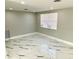 Bright living room with modern flooring and lots of natural light at 6220 Westport Dr, Port Richey, FL 34668