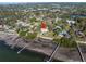 Aerial view of house nestled on waterfront lot with private dock at 7172 Dr Martin Luther King Jr S St, St Petersburg, FL 33705