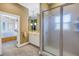 Bathroom with double vanity, shower, and a view into a bedroom at 7172 Dr Martin Luther King Jr S St, St Petersburg, FL 33705