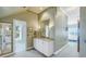 Double vanity bathroom with access to other rooms at 7172 Dr Martin Luther King Jr S St, St Petersburg, FL 33705