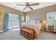 Bedroom with private balcony and ceiling fan at 7172 Dr Martin Luther King Jr S St, St Petersburg, FL 33705