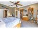 Bedroom with built-in bookcase and ceiling fan at 7172 Dr Martin Luther King Jr S St, St Petersburg, FL 33705
