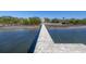 Long wooden dock leading to the house at 7172 Dr Martin Luther King Jr S St, St Petersburg, FL 33705