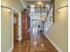 Elegant two-story entryway with hardwood floors and a grand staircase at 7172 Dr Martin Luther King Jr S St, St Petersburg, FL 33705