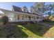 Two-story house with a wraparound porch and a brick walkway at 7172 Dr Martin Luther King Jr S St, St Petersburg, FL 33705