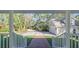 View from the front porch to the driveway and attached garage at 7172 Dr Martin Luther King Jr S St, St Petersburg, FL 33705