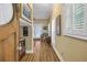 Bright hallway with hardwood floors and access to other rooms at 7172 Dr Martin Luther King Jr S St, St Petersburg, FL 33705