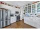 Kitchen with stainless steel appliances and white cabinets at 7172 Dr Martin Luther King Jr S St, St Petersburg, FL 33705