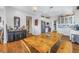 Kitchen features white cabinets, stainless steel appliances, and wood floors at 7172 Dr Martin Luther King Jr S St, St Petersburg, FL 33705
