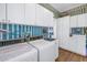 Laundry room with ample storage and modern appliances at 7172 Dr Martin Luther King Jr S St, St Petersburg, FL 33705