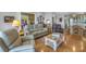 Comfortable living room with hardwood floors and neutral colored furniture at 7172 Dr Martin Luther King Jr S St, St Petersburg, FL 33705