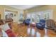 Open living room with hardwood floors and access to deck at 7172 Dr Martin Luther King Jr S St, St Petersburg, FL 33705