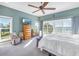 Main bedroom with water views, ceiling fan, and ample natural light at 7172 Dr Martin Luther King Jr S St, St Petersburg, FL 33705