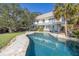 Freeform pool with expansive patio and house view at 7172 Dr Martin Luther King Jr S St, St Petersburg, FL 33705