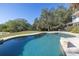 Large freeform pool with spacious patio at 7172 Dr Martin Luther King Jr S St, St Petersburg, FL 33705