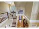 Elegant staircase with wooden railings and hardwood floors at 7172 Dr Martin Luther King Jr S St, St Petersburg, FL 33705